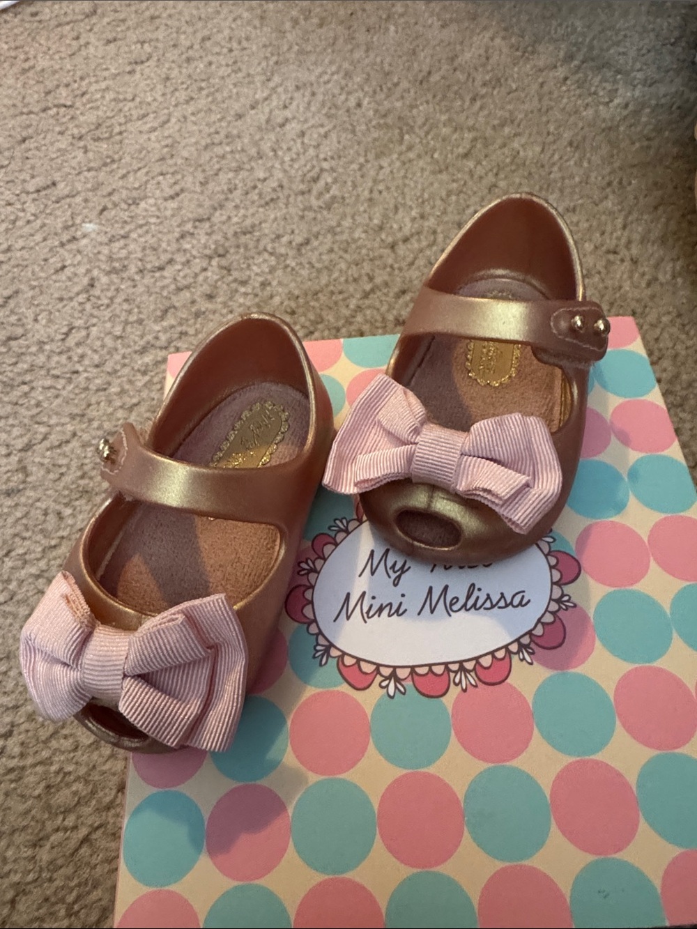 Mini Melissa Metallic Rose Gold Mary Janes with Pink Fabric Bows. Used w/box
